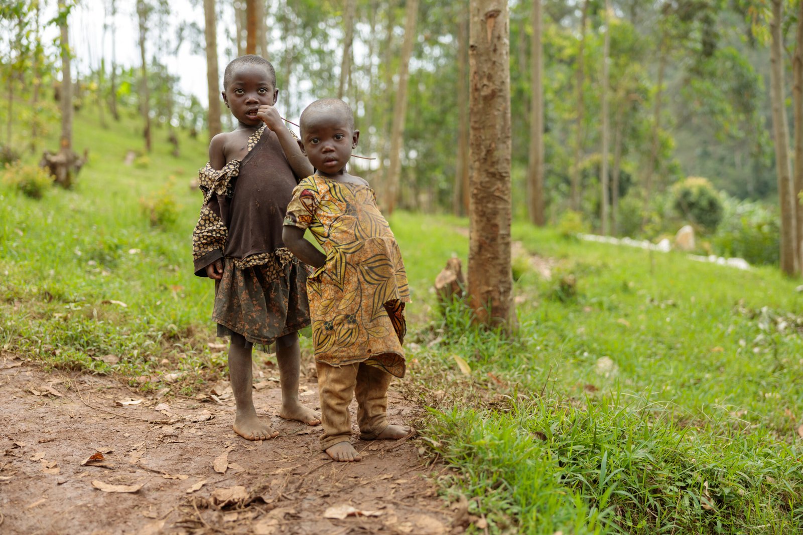 Full-length photo of children in old clothes in a local village in Africa